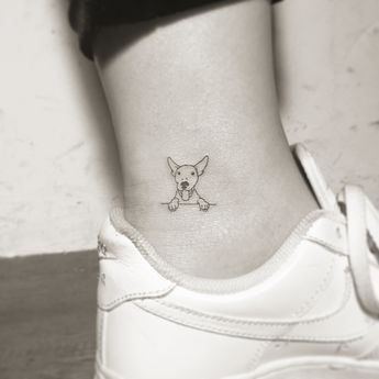 17 Insanely Cute And Tasteful Tattoos Small Dog Tattoo, Tatoo Dog, Small Dog Tattoos, Tasteful Tattoos, Initial Tattoo, Arrow Tattoo, Subtle Tattoos, Foot Tattoo, Dog Tattoo