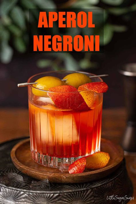 Aperol Negroni is the ideal deviation from the classic for lovers of the Negroni. Made using Italian bitters this Negroni with Aperol sports a vivid orange hue plus plenty of bittersweet flavour. It's less intensely bitter than the classic Negroni but just as easy to prepare and a delight to linger over. Aperol Cocktails, Aperol Negroni, Aperol Cocktail Recipes, Aperol Negroni Cocktail, Negroni Cocktail Aesthetic, Negroni Sbagliato Recipe, Aperol Drinks, Non Alcoholic Negroni, Classic Negroni Cocktail Recipe