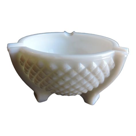 This piece of early American Tobacciana is a heavy high quality three toed milk glass ashtray that was made by the Le. Smith Glass Co. The ashtray is pressed glass pressed in the English Hobnail pattern that was inspired by Westmoreland glass Co. who originated the pattern in the 1920's. The English Hobnail pattern is a raised glass geometric diamond hobnail design that surrounds the whole piece which Le. Smith made their own mold to create this one of a kind three toed ashtray version that was L E Smith Glass Vintage Patterns, Franklin And Friends, Milk Glass Mug, Milk Glass Pincushion, Colored Milk Glass Vintage, Westmoreland Glass, Vintage Glass Ashtrays, Geometric Diamond, White Milk Glass