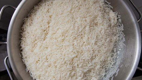 The Easy Tip For Cooking A Large Batch Of Rice In The Oven — Tasting Table How To Cook Rice For A Large Crowd, Cooking Rice On Stove, Boiling Rice On Stove, Cooking Long Grain Rice On Stove, Long Grain Rice How To Cook, Rice In The Oven, Rice On The Stove, Oven Canning, Cooking Method