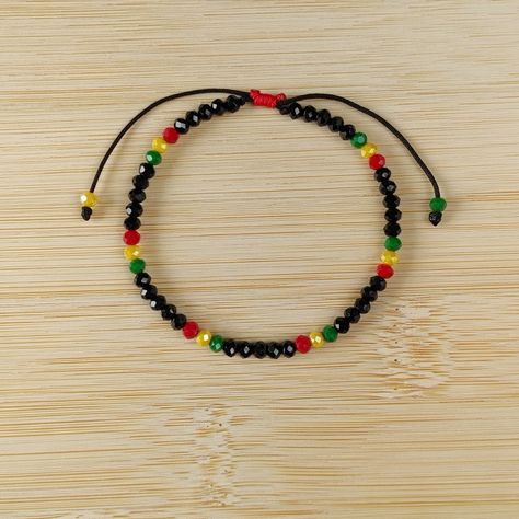 Rasta Bracelet - Bob Marley Reggae Inspired Dainty Glass Beads Shiny Bracelet - Handmade Boho Chic Jewelry - Adjustable and Waterproof, Minimalist Cool Gift for Her Introducing my Rasta Bracelet - a harmonious blend of Rastafari-inspired colors and the elegant touch of Austrian glass beads. Whether you're channeling reggae vibes or looking for a minimalistic piece that speaks volumes, this bracelet is your perfect accessory. Handmade with love and positivity in Madrid, Spain, it's not just jewel Rasta Bracelet, Adjustable String Bracelet, Jamaican Colors, Shiny Bracelets, Etsy Jewelry Handmade, Beads Art, Boho Chic Jewelry, Handmade Gifts For Her, Best Gifts For Her