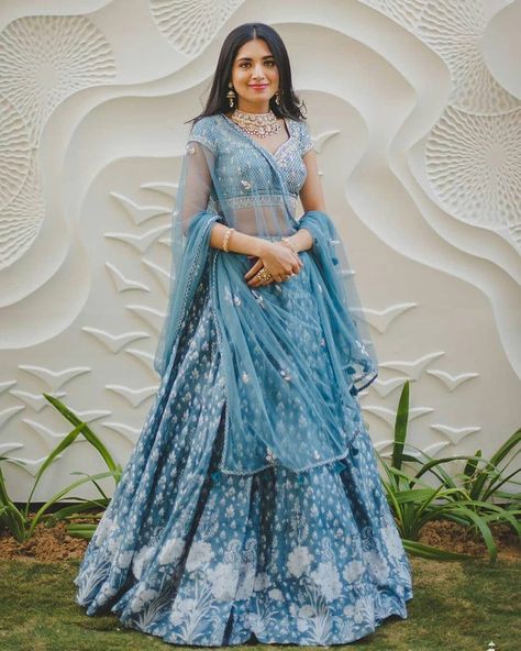 Wearing a blue bridal lehenga for your big day? These blue bridal lehengas will up your glamour quotient. Take cues. #blue #bluelehenga #bluecoloredoutfits #bluedresses #bridallehenga #bluebridallehenga #indianbrides #bridalwear #Lehengadesigns #indianwear #lehengainspiration #sabyasachilehenga #anitadongrelehenga #manishmalhotralehenga #shararadesigns #pakistanibrides #bridemaidslehenga #sangeetoutfit #haldioutfit #mehendioutfit #bridalmakeup #bridaljewellery #sequinslehenga Lehenga Color Combinations, Dupatta Draping Styles, Sabyasachi Lehenga Bridal, Dupatta Draping, Lehenga Ideas, Draping Styles, Bridal Dupatta, Sabyasachi Lehenga, Latest Bridal Lehenga