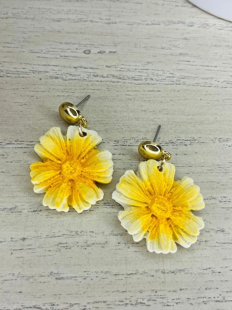 Add a touch of sunshine to your look with these stunning flower stud earrings featuring a vibrant yellow mica coating. These earrings are perfect for adding a pop of color to any outfit and will effortlessly brighten your day. Handcrafted with care and attention to detail, these earrings are a must-have for any floral lover or anyone looking to make a bold style statement. Upgrade your jewelry collection with these beautiful and unique flower stud earrings today! Unique Flower, Flower Stud Earrings, Sunshine Yellow, Flower Stud, Bold Style, Nature Inspired Jewelry, Unique Flowers, Inspired Jewelry, Flower Earrings Studs