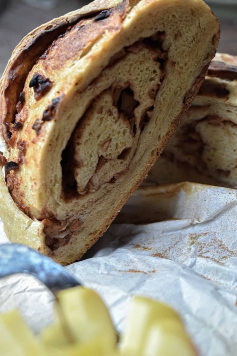 Half of the apple cinnamon sourdough bread is leaning against the other half of the bread. Cinnamon Pecan Sourdough Bread, Apple Cinnamon Sourdough Bread, Cinnamon Sourdough Bread, Cinnamon Sourdough, Applesauce Pancakes, Apple And Cinnamon, Bread At Home, Cinnamon Pecans, Maple Pecan