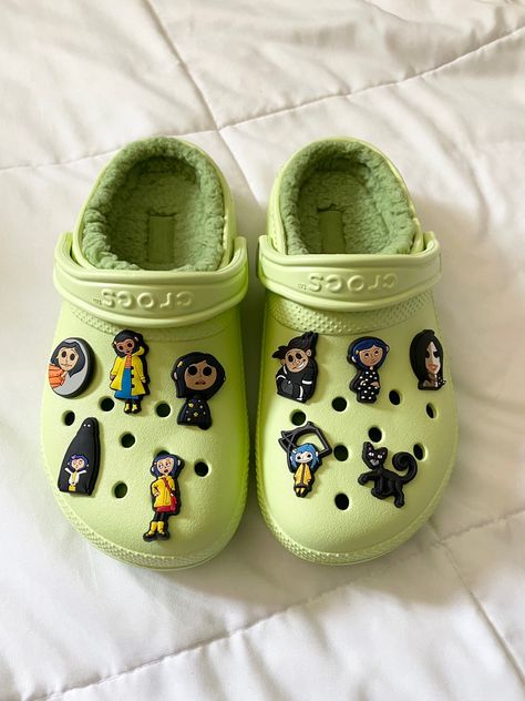 Coraline Crocs for Halloween/Spooky Season Unique Crocs Shoes, Light Green Crocs With Charms, Sage Green Crocs, Green Crocs With Jibbitz, Croc Themes, Green Crocs With Charms, Crocs With Charms Ideas, Crocs Charm Ideas, Crocs Gibbets