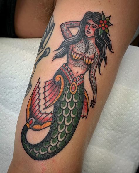 Tattooed Mermaid Tattoo | Tattoo Ideas and Inspiration Vintage Mermaid Tattoo, Traditional Mermaid, Traditional Mermaid Tattoos, Traditional Dagger Tattoo, Independent Tattoo, Mermaid Tattoo Designs, Traditional Tattoo Old School, Pin Up Girl Tattoo, Traditional Tattoo Sleeve