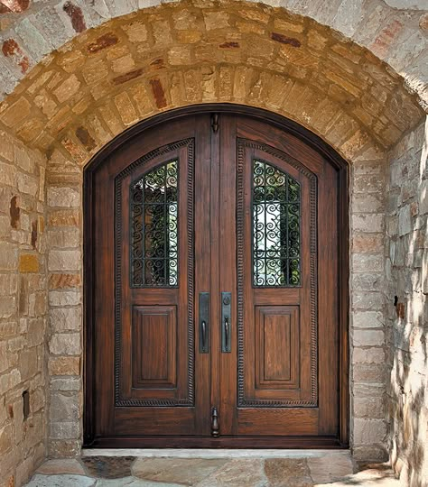 This custom grilled front entry was made using antique door panels and reclaimed Douglas fir. The arched double doors feature inlaid carved antique panels. Arched Double Doors, Spanish Doors, Arched Front Door, Double Door Entryway, Entry Door Designs, Double Door Entrance, House Front Door Design, Modern Wooden Doors, Gates Design