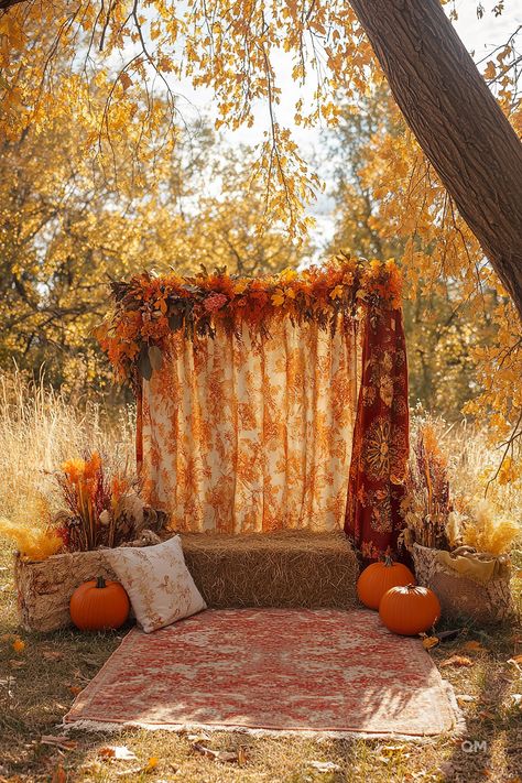 Cozy fall decor setup in the woods with pumpkins, a rustic hay bale seat, and autumn-themed drapes. Perfect inspiration for fall decorating ideas. Fall Decor For Photo Shoot, Harvest Festival Photo Backdrop, Fall Mini Sessions Hay Bales, Simple Fall Photo Backdrop, Indoor Fall Mini Session Ideas, Easy Fall Photo Backdrop, Studio Fall Mini Sessions, Diy Fall Photo Backdrop, Outdoor Studio Photography