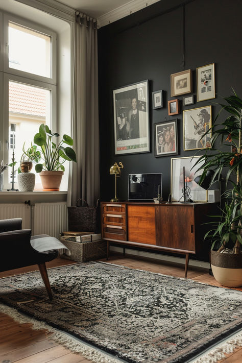 A stylish living room with a black accent wall adorned with various framed artworks, modern furniture, and lush plants Black Accent Living Room Wall, Interior Design Black Accents, Dark Colour Living Room Ideas, Black Front Room Ideas, Black And Wooden Living Room, Black Walls White Furniture, Black Wall Living Room Ideas, Moody Interior Design Living Rooms, Grunge Living Room Aesthetic