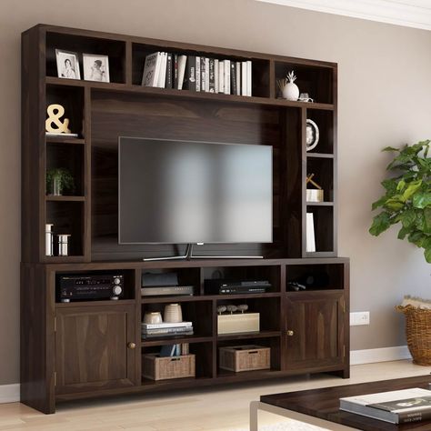 Our Buras Rosewood Wall Unit TV Console Entertainment Center is the embodiment of traditional living with a casual vibe. This solid wood entertainment center is a powerhouse of display and storage. The motif of rectangular shelf space that wraps the body of the unit grants a pleasant visual appeal while also serving terrific functionality. The expansive hutch houses seemingly endless options for storage and display in a frame around your family's television with ample space to display books, DVD Living Room Ideas With Tv, Room Ideas With Tv, Small Living Room Ideas With Tv, Tv Shelf Design, Tv Shelving, Media Entertainment Center, Wall Unit Designs, Entertainment Wall Units, Tv Unit Decor