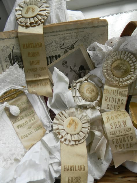 Antique creamy horse ribbons displayed on an old literary newspaper with frothy white linens! Horse Ribbon Display, Horse Show Ribbons, Horse Ribbons, Equestrian Home Decor, Ribbon Display, Award Ribbons, Vintage Equestrian, Equestrian Home, White Linens