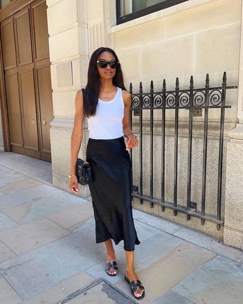 The Hermès Oran Sandals Minimalists Have Worn for Years | Who What Wear UK Hermes Oran Sandals Outfit, Satin Skirt Outfit Summer, Black Satin Skirt Outfit, Black Sandals Outfit, Sandal Outfits, Sandals Outfit Summer, Hermes Oran Sandals, Black Satin Skirt, Satin Skirt Outfit