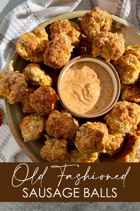 A serving dish filled with Old Fashioned Sausage Balls and a ramekin of Cajun Dipping Sauce Cajun Sausage Balls, Sausage Ball Dip, Southern Sausage Balls, Sausage Balls Dipping Sauce, Sausage Ball Dipping Sauce, Sauce For Sausage Balls, Dipping Sauce For Sausage Balls, Dipping Sauce For Sausage, Dip For Sausage Balls