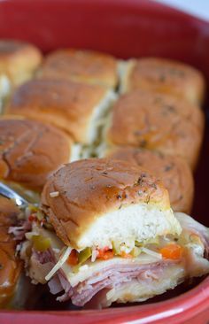 Muffalata Oven Baked Sandwiches - This Italian Sandwich is loaded with meat, cheese and olive salad. A New Orleans favorite, baked in the oven and perfect for feeding a crowd! Muffalata Sliders, Muffelata Sliders, Muffelata Sandwich Recipe, Oven Baked Sandwiches, Ciabatta Sandwich, Muffaletta Sandwich, Muffuletta Sandwich, Baked Sandwiches, Hp Sauce