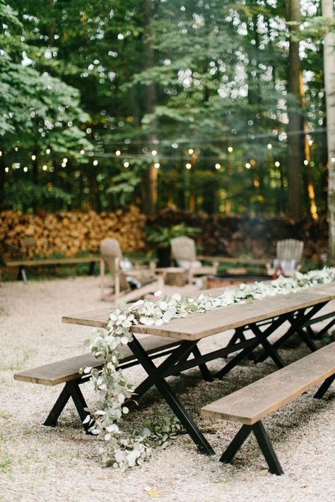 Picnic tables draped with floral garlands and twinkle lights are perfect for an outdoor wedding reception.  #love #inspiration #diy #wedding #decorgoals #ideas Picnic Table Wedding, Outdoor Wedding Cake, Outdoor Wedding Ideas, Wedding Cake Display, Diy Outdoor Weddings, Wedding Lounge, Garden Venue, Outdoor Trees, Picnic Tables