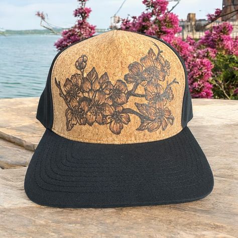 Burned Cork Hat using Pyrography techniques. Freehand burned making these Hats a One of A Kind. Cork is a natural water repellent. The burn actually gets darker when in the rain. Trucker Hats come with a signature market bag. Sakura Branch, Painted Hats, Velvet Hat, Market Bag, Custom Hats, Pyrography, In The Rain, Trucker Hats, The Rain