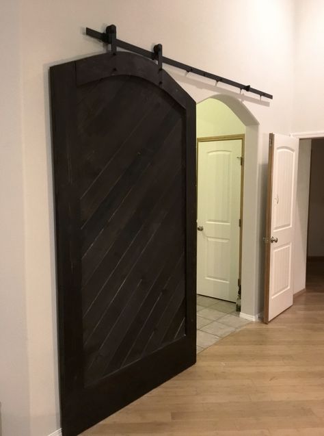 Sliding Barn Door Over Archway, Barn Door With Arched Doorway, Barn Door For Curved Doorway, Archway Sliding Door, Covering Arched Doorway, Barn Door Over Arched Doorway, Arched Barn Doors In The House, Arched Sliding Doors Interior, Door For Arched Doorway