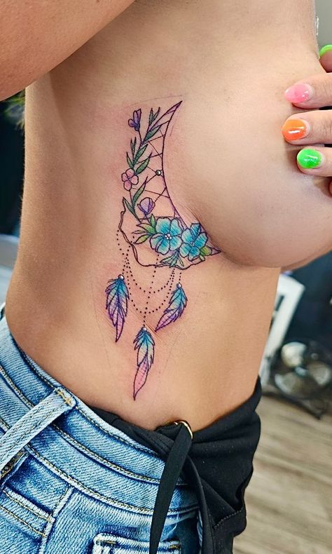 Side tattoo, women, half moon, dreamcatcher, flowers, feathers Dream Catcher Tattoo On Ribs, Dreamcatcher Tattoos For Women, Dream Catcher Tattoo Design For Women, Side Tattoo Women, Dream Catcher Rib Tattoo, Moon Dreamcatcher Tattoo, Dream Catcher Tattoo On Thigh, Dreamcatcher Tattoo Thigh, Dreamcatcher Tattoos