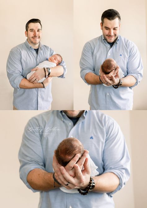 Dad in blue oxford shirt holds sleeping baby in white wrap. Dad holding baby's head in hands and looking at baby. Boston, MA. Holding Baby Reference, Holding Baby Poses Drawing, Man Holding Baby Drawing Reference, Man Holding Baby, Sitting Up Baby, Father Holding Baby, Dad Holding Baby, Head In Hands, Newborn In Dads Hands