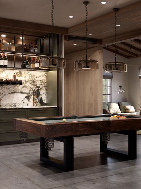 A special place is designated for the billiards room. It’s a separate space that can be divided into several zones for different leisure scenarios. The billiards table takes center stage. A wine fridge, mini kitchen for cocktail preparation, and custom bar counter create a space for heartfelt conversations over drinks. The gaming machine contrasts with the classic billiards table but speaks to the owners’ sense of humor. Bar Rec Room Ideas, Pool Table Room With Bar, Modern Games Room, Pool Table Restoration Diy, Luxury Games Room, Moody Game Room Ideas, Home Pool Table Room, Bar And Pool Table Room, Upstairs Game Room Ideas