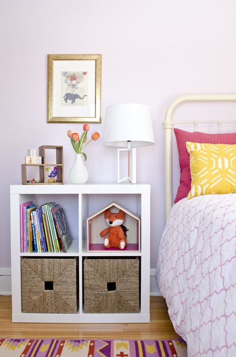 Bookshelf with storage used as a side table in this girl's bedroom makeover. #SWPaintingWeek @Sherwin-Williams Kids Bedroom Nightstand, Purple Night Stand, Kids Room Nightstand, Sherwin Williams Potentially Purple, Wallflower Sherwin Williams, Purple Kids Room Ideas, Kids Bedside Table Ideas, Purple Nightstand, Kids Side Table