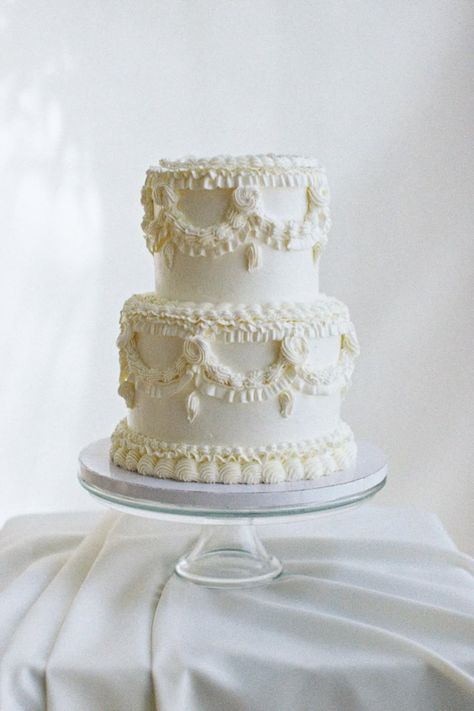 Elegant two-tier white wedding cake with vintage-inspired piping details. A timeless dessert design. Traditional White Wedding Cake, Jeni's Ice Cream, Dessert Design, Vintage Wedding Cake, Real Photography, Cake Style, Photography Career, Massachusetts Wedding, Wedding Cakes Vintage