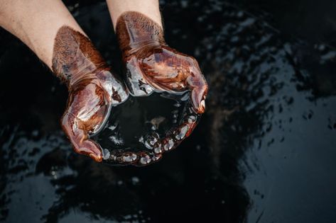 Hands are soaked in crude oil against the background of spilled petroleum Ancient Alexandria, Underwater Ruins, Biomass Energy, Oil Drip, Renewable Energy Resources, Ornate Jewelry, Alternative Energy Sources, Oil Drum, Energy Resources