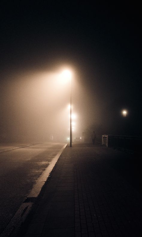 Personal project, 2014/15Captured in cold foggy nights in Hamburg, Germany. Streetlamps In The Fog, Cold Person Wallpaper, Streetlights At Night, Cold Photos, Cold Person, Germany Night, Street Photography Graffiti, Night Person, Light Bulb Art