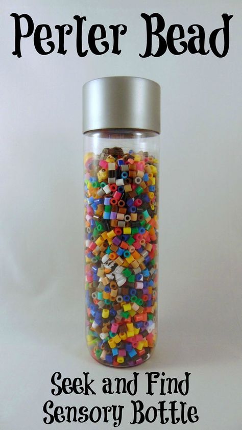 Perler Bead Seek and Find Bottle.  An easy and fun craft #perlerbeads #craftsforkids #crafts Voss Water Bottle, Guessing Jar, Sensory Bottle, Seek And Find, Sensory Bottles, Clear Container, Diy Perler Beads, Pickle Jars, Fun Craft