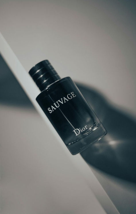 Experience the irresistible allure of Dior Sauvage. This iconic fragrance blends fresh bergamot, spicy Sichuan pepper, and deep amber wood to create a bold and captivating scent. Perfect for any occasion, Dior Sauvage exudes confidence and sophistication. Feel empowered and unforgettable. Keywords: Dior Sauvage, iconic fragrance, captivating scent, confidence, sophistication, long-lasting, high-quality, timeless elegance. Dior Savage, Mens Perfume, Perfume Logo, Blue Stuff, Dior Sauvage, Sichuan Pepper, Dior Perfume, Men's Fragrance, Perfume Collection