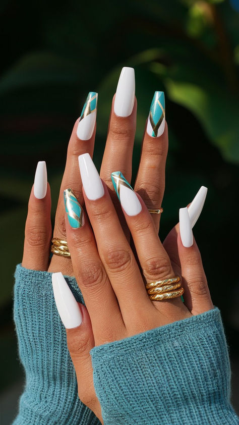 Elevate your nail game with these stunning long coffin-shaped white nails, beautifully embellished with vibrant turquoise and luxurious gold elements! The pristine white base offers a clean canvas, while the turquoise pops add a touch of color, and the gold accents bring a dash of glam. Perfect for weddings, parties, or just to feel fabulous every day, this nail design combines sophistication with a playful twist. Get ready to turn heads with this elegant nail art! 💅🌟 White And Turquoise Nails Acrylic, White And Turquoise Nails, Teal And White Nail Designs, Nails Teal And White, Gold Turquoise Nails, Turquoise White And Gold Nails, Turquoise Nail Designs, Nail Color Combinations, Turquoise Nails