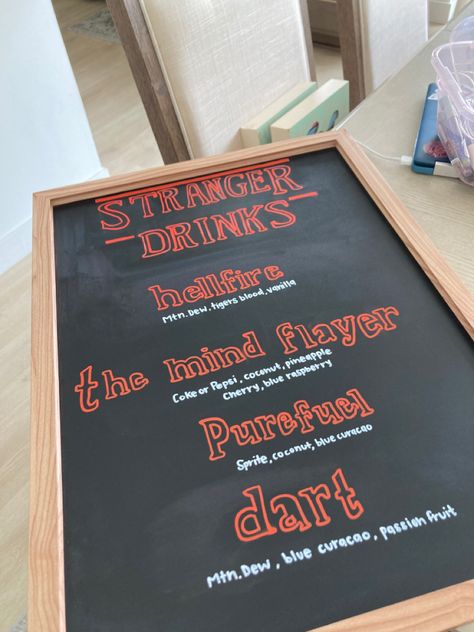 Chalkboard sign with drinks dedicated to characters and names of the the upcoming Season 4 episodes. Stranger Things Drinks Non Alcoholic, Stranger Things Wedding Theme, Stranger Things Theme Party Food, Stranger Things Drinks, Stranger Things Menu Ideas, Stranger Things Birthday Party Ideas Food, Stranger Things Cocktails, Stranger Things Sleepover Ideas, Stranger Things Games For Party