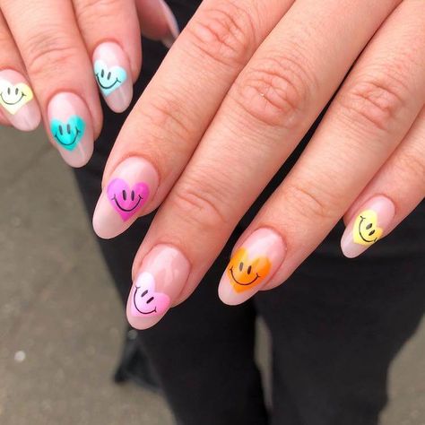 Go all out this summer with these cute smiley face nail designs. I love that different colors such as orange, yellow, pink,and blue were used for these happy face nails. Summer Nail Design Ideas, Heart Smiley, Beautiful Dawn, Cute Smiley Face, Summer Nail Designs, Nail Design Ideas, Rainbow Nails, Happy Heart, Heart Nails