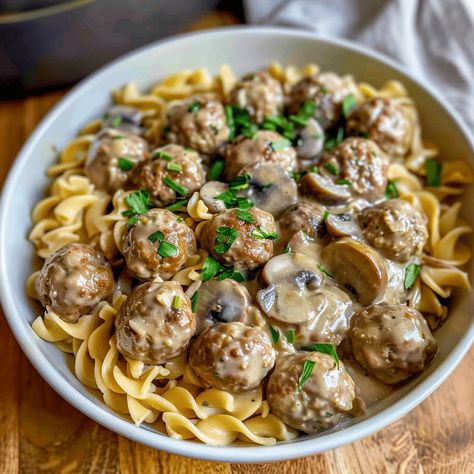 Comforting Meatball Stroganoff with tender meatballs in a creamy mushroom sauce, served over egg noodles. Ready in 30 minutes! Turkey Meatball Stroganoff, Meatball Stroganoff Recipe, Beef Stroganoff Meatballs, Traditional Beef Stroganoff, Scallop Potatoes, Meatball Stroganoff, Mushroom Meatballs, Perfect Meatballs, Tender Meatballs