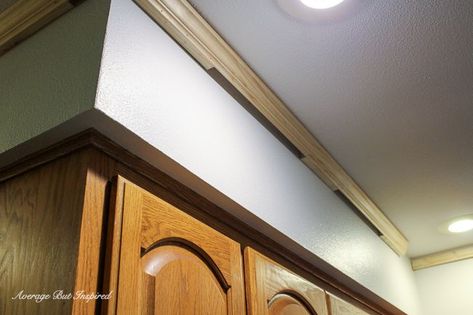 DIY Kitchen Soffit Makeover: How to Disguise a Kitchen Soffit - Average But Inspired Large Kitchen Soffit Overhang, Soffett In Kitchen, Kitchen Soffit Makeover, Soffit Makeover, Soffit Ideas, Kitchen Cabinet Molding, Redo Kitchen, Cream Colored Kitchen Cabinets, Painting Laminate Countertops