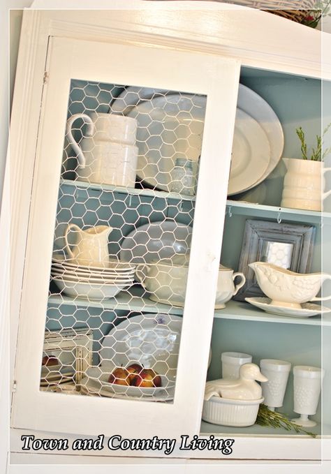 Recently our cat broke the stenciled glass in the china cabinet. Rather than get upset, I took the opportunity to swap out the broken glass with chicken wire an… Linen Hutch, Chicken Wire Cabinets, Farmhouse Mugs, Cabinet Fronts, Design Room, Diy Kitchen Cabinets, Farmhouse Furniture, Chicken Wire, Kitchen Redo