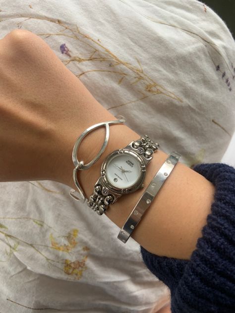 Silver Watch Bracelet Stack, Silver Jewerly Girl Aesthetic, Silver Bracelet Stack With Watch, Silver Jewellery Watch, Silver Jewellery Stacking, Silver Watch And Bracelet Stack, Silver Watch Aesthetic Women, Silver Vintage Watches Women, Silver Wrist Stack