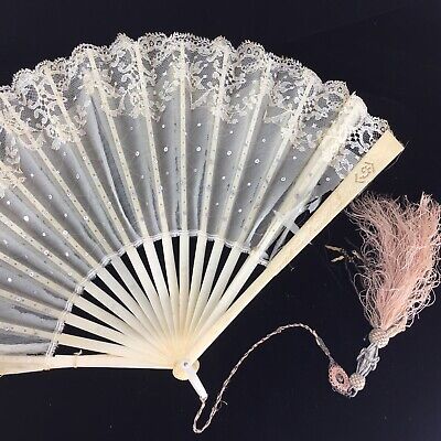 The previous owner was a serious collector of fans from all over the world. The collector identifies this one as a wedding fan made from lace and wood. The minute white sequins with woven white thread serve to highlight the simplicity of the lace background. Wedding Fan, Party Fans, Lace Background, Vintage Lace Weddings, Fancy Hands, Folding Hand Fan, Wedding Fans, Vintage Fans, Hand Fans