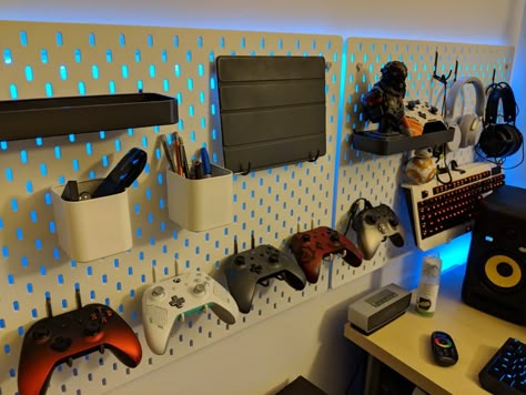 Industrial Gamer Room, Remote Wall Holder, Peg Board In Bedroom, Ikea Pegboard Boys Room, Gamer Room Organization, Pegboard Game Room, Ikea Pegboard Gaming Setup, Ikea Wall Pegboard, Gaming Room Pegboard