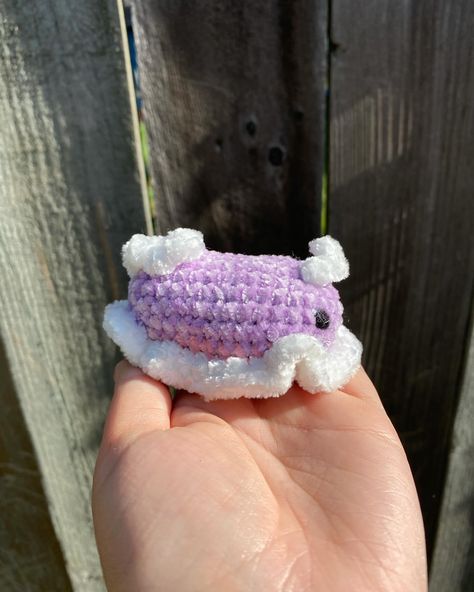 I just love how this cutie turned out, so I have to post about it again! It’s so small it could fit into a pocket but so cute that you probably don’t want to do that 😂 If you want to make your own Nudibranch cutie, check out my free low to no-sew crochet pattern! #crochet #crocheting #crochetlove #crochetersofinstagram #crochetnudibranch #crochetanimal #amigurumi #amigurumilove #freepattern #amiguruminudibranch #nudibranch #seacreatures #smallbusiness #etsyshop #summervibes #pink #purple #... Nudibranch Crochet, Slug Crochet Pattern, Slug Crochet, Sea Slug, Crochet Pattern Amigurumi, Slug, Pattern Crochet, Crochet Animals, Amigurumi Pattern