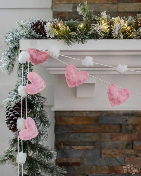 This DIY no-sew fabric heart banner is a sweet decor accent for Valentine's Day. The best part? It only takes 30 minutes to make and it doesn't require any sewing at all. Valentines Day Home Decor, Black Mantle, Valentine Garland, Diy Valentine's Day Decorations, Valentine Banner, Heart Banner, Winter Decorations Diy, Diy Valentines Decorations, Diy Yarn Crafts