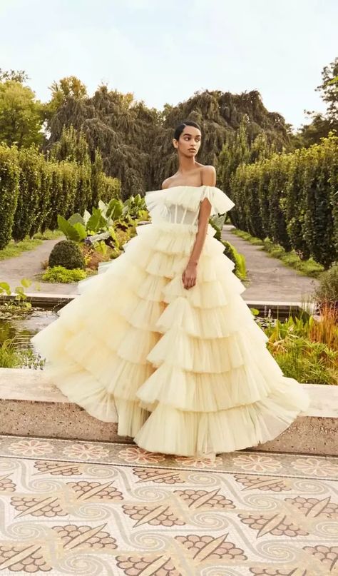 Turn heads at your tropical destination wedding in this show-stopping tiered wedding dress. The light yellow is subtle yet bold, while the sheer bodice provides an extra wow-worthy element. See more gorgeous pastel wedding dresses at the link. // Photo: Andrew Kwon Pastel Wedding Dresses, Buy Wedding Dress Online, Buy Wedding Dress, Ruffle Wedding Dress, Pastel Wedding, Yellow Wedding, Bridal Fashion Week, Wedding Dress Trends, Colored Wedding Dresses