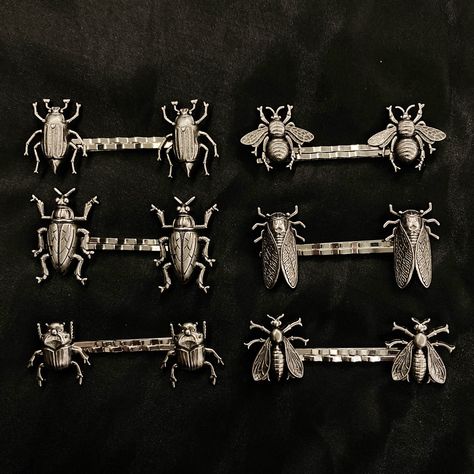 "With this you get 1 set of 2 silver metal hair pins featuring aged silver colored winged insects. Please specify which set you want! Pic 1: Long Beetle Pic 2: Winged Beetle Pic 3: Round Beetle Pic 4: Bee Pic 5: Cicada Pic 6: Fly They are all around 2 1/2\" long and around 1\" wide. Make sure to check out my shop for more hair pins, jewelry, accessories, and all sorts of fun stuff! Insect Hair Pins, Insect Jewelry, Cicada Hair Pins, Fly Hair Pins, Bug Hair Pins, Bee Hair Pins, Beetle Hair Pins, Winged Beetle, Goblincore Jewelry, Winged Insects, Bug Jewelry, Metalsmithing Jewelry, School Jewelry, Beautiful Bugs, Insect Jewelry, Metal Hair