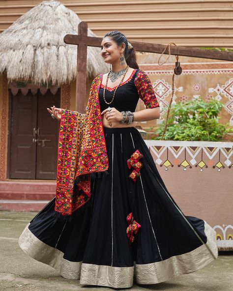 Celebrate Navratri style Rich black color with embroidery & mirror work and viscose rayon dupatta 🖤✨ SHOP NOW 🛍️ gotifab.com [lehengacholi, garba outfits, navratri lehengas, navratri collection,navratri chaniya choli,navratri collection ] #lehengacholi #navratrilehenga #navratricollection #navratri #navratrichaniyacholi #garbaoutfit Garba Outfit, Navratri Lehenga, Chaniya Choli Designs, Mirror Work Lehenga, Mirror Work Blouse, Black Lehenga, Navratri Chaniya Choli, Bridesmaid Saree, Work Lehenga