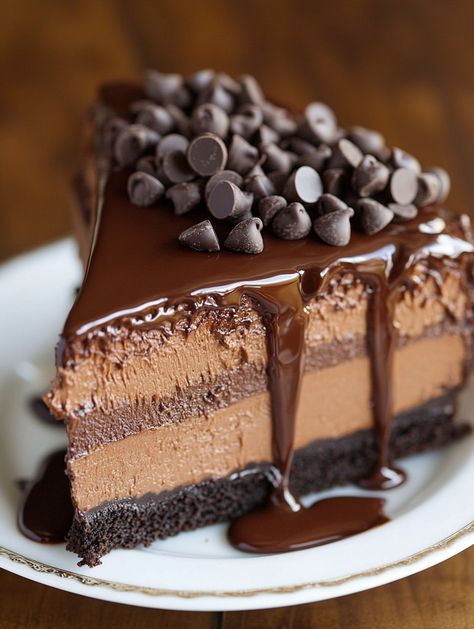 Copycat Hershey’s Chocolate Bar Cheesecake  🍫 Ingredients 🍫  For Chocolate Cake Layers: 1 cup (130g) all-purpose flour 1 cup (207g) sugar 6 tbsp (43g) natural unsweetened cocoa powder 1 tsp baking soda 1/4 tsp baking powder 1/2 tsp salt 1/2 cup (120ml) milk 1/4 cup (60ml) vegetable oil 1/2 tsp vanilla extract 1 large egg 1/2 cup (120ml) hot water For the Chocolate Cheesecake: 24 oz (678g) cream cheese, room temperature 1 cup (207g) sugar 1/2 cup (57g) natural unsweetened cocoa powder Hot Chocolate Cheesecake, Cheesecake Ingredients, Unsweetened Cocoa Powder, Chocolate Chip Cheesecake, Cake Layers, Chocolate Lava Cake, Chocolate Bomb, Lava Cakes, Pie Cake