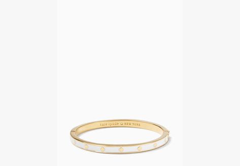 We say stack your bracelets to make a statement. This makes the first one in your pile. Or the 100th. | Kate Spade Spot The Spade Enamel Hinged Bangle, White Bracelets To Make, Kate Spade Bracelet, Pink Plates, Kate Spade Outlet, Enamel Bangle, Buy Buy, Gold Polish, Hinged Bangle, Girly Jewelry