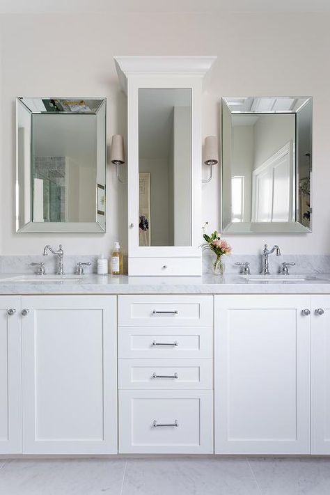 Beveled vanity mirrors are hung flanking a glass front white medicine cabinet lit by nickel sconces accented with taupe shades. Brick Tile Shower, White Medicine Cabinet, Bathroom Furniture Uk, Blue Shower Tile, Tile Shower Niche, Cheap Bathroom Vanities, Small Bathroom Mirrors, Bathroom Sink Design, Ikea Bathroom