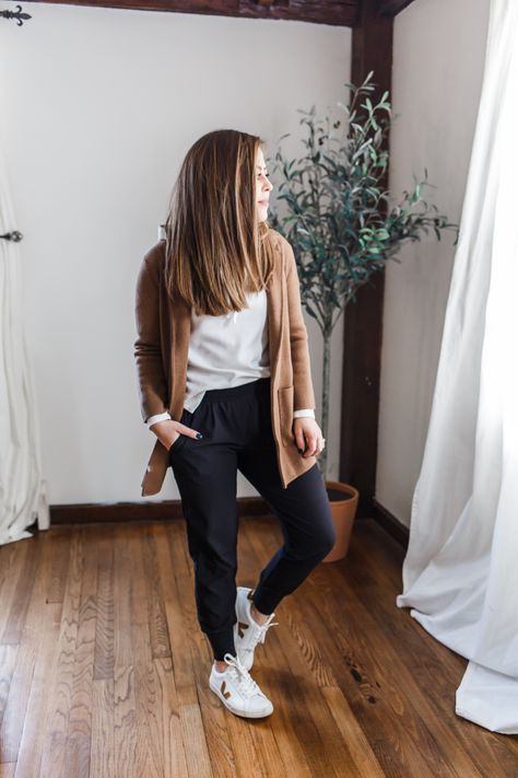 5 ways to style black joggers. Sneakers And Joggers Outfit, Womens Joggers Outfit Dressy Work, Black Jogger Travel Outfit, Joggers With Cardigan Outfit, Tan Athletic Pants Outfit, Women Black Joggers Outfit, Jogger Cardigan Outfit, Thanksgiving Jogger Outfit, Black Joggers Travel Outfit