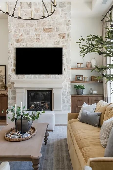 Top 10 Reasons to Renovate Your Fireplace - Nikki's Plate Mantel Over Stone Fireplace, Fireplace With Cutouts On Side, 20ft Fireplace Wall, Neutral Stone Fireplace, European Farmhouse Fireplace, Stone Fireplace With White Mantle, Fireplace Tall Ceilings, Stone Fireplace With Tv, Stone Tv Wall