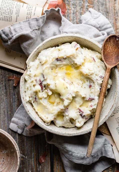 Mashed red potatoes are made even better with lots of herbs and goat cheese. Easy mashed potato recipe with shallots, cheese, rosemary, garlic, and thyme. #garlicmashedpotatoes #goatcheesemashedpotatoes #redmashedpotatoes #twocupsflour Garlic Smashed Potatoes, Crockpot Mashed Potatoes, Cheese Mashed Potatoes, Vegan Mashed Potatoes, Buttermilk Recipes, Making Mashed Potatoes, Garlic Mashed Potatoes, Mashed Potato Recipes, Garlic Mashed